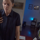 A woman looks terrified as she gazes at her phone